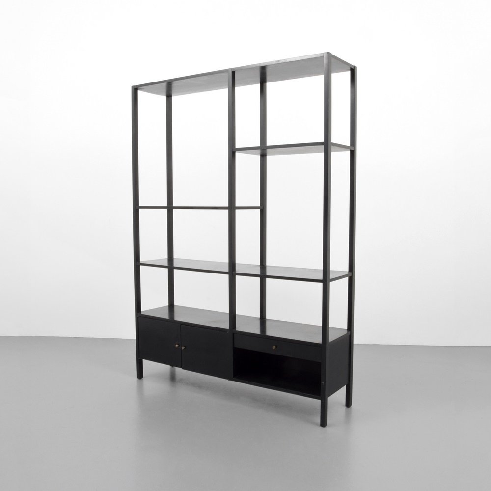 Paul McCobb Shelving Unit: Designer & Manufacturer: Paul McCobb; Winchendon Furniture Co. Markings: marking(s) Country of Origin & Materials: USA; wood, metal Additional Information: Cabinet has two doors revealing storage, one