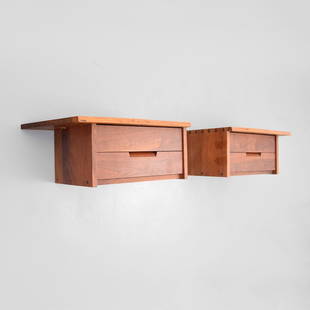 Pair of George Nakashima Wall Mounted Cabinets: Designer & Manufacturer: George Nakashima Markings: marking(s) Country of Origin & Materials: USA; walnut Additional Information: Each cabinet/nightstand has two drawers. Provenance: Artist (approxima