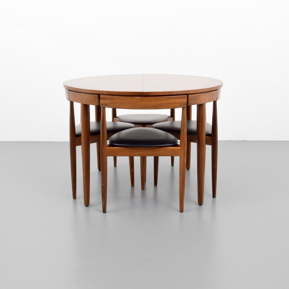 Hans Olsen Dining Table & 6 Chairs: Designer & Manufacturer: Hans Olsen; Frem Røjle (Rojle) Markings: marking(s) Country of Origin & Materials: Denmark; wood, upholstery Additional Information: Table has a 19.75" wide self-storing leaf