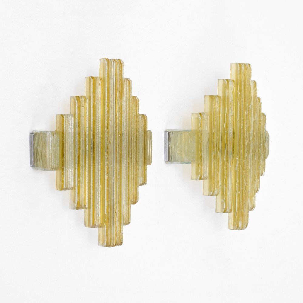 Pair of Poliarte Sconces, Murano: Designer & Manufacturer: Poliarte Markings: no marking(s) apparent Country of Origin & Materials: Italy; glass, chromed metal Additional Information: Reference (similar forms): Poliarte, Frank Rogin, 