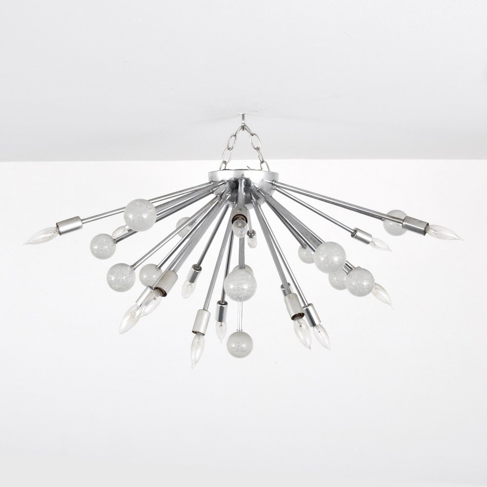 Sputnik Ceiling Light: Designer & Manufacturer: unknown Markings: no marking(s) apparent Country of Origin & Materials: unknown; chromed metal, plastic Additional Information: Ceiling height has fifteen light sockets. (Key 
