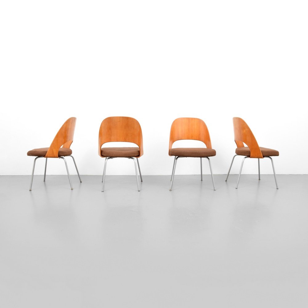Early Eero Saarinen Dining Chairs, Set of 4: Designer & Manufacturer: Eero Saarinen; Knoll Markings: remnants of label to one chair Country of Origin & Materials: USA; metal, wood, upholstery Additional Information: Chairs are model 72 PSB-1. Re