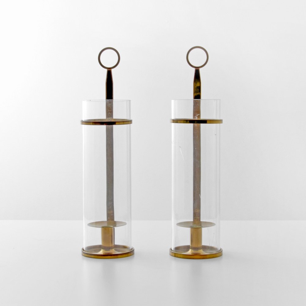 Pair of Tommi Parzinger Candlestick Holders: Designer & Manufacturer: Tommi Parzinger; Dorlyn Silversmiths Markings: marking(s) Country of Origin & Materials: USA; brass, glass Additional Information: (Key Word Search: James Mont, Serge Roche, K