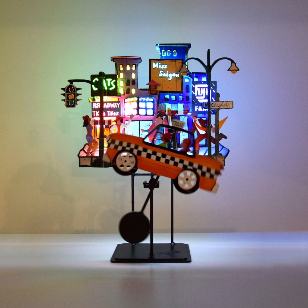 Large Frederick Prescott Lit Sculpture: Designer & Manufacturer: Frederick Prescott (b. 1949) Markings: signed; 11/125; 1996 Country of Origin & Materials: American; metal Additional Information: Work is kinetic with neon and titled BROADWA