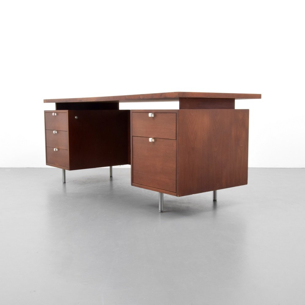 George Nelson Executive Desk: Designer & Manufacturer: George Nelson; Herman Miller Markings: marking(s) Country of Origin & Materials: USA; wood, mica, metal, caning Additional Information: Desk has four drawers, a file cabinet,
