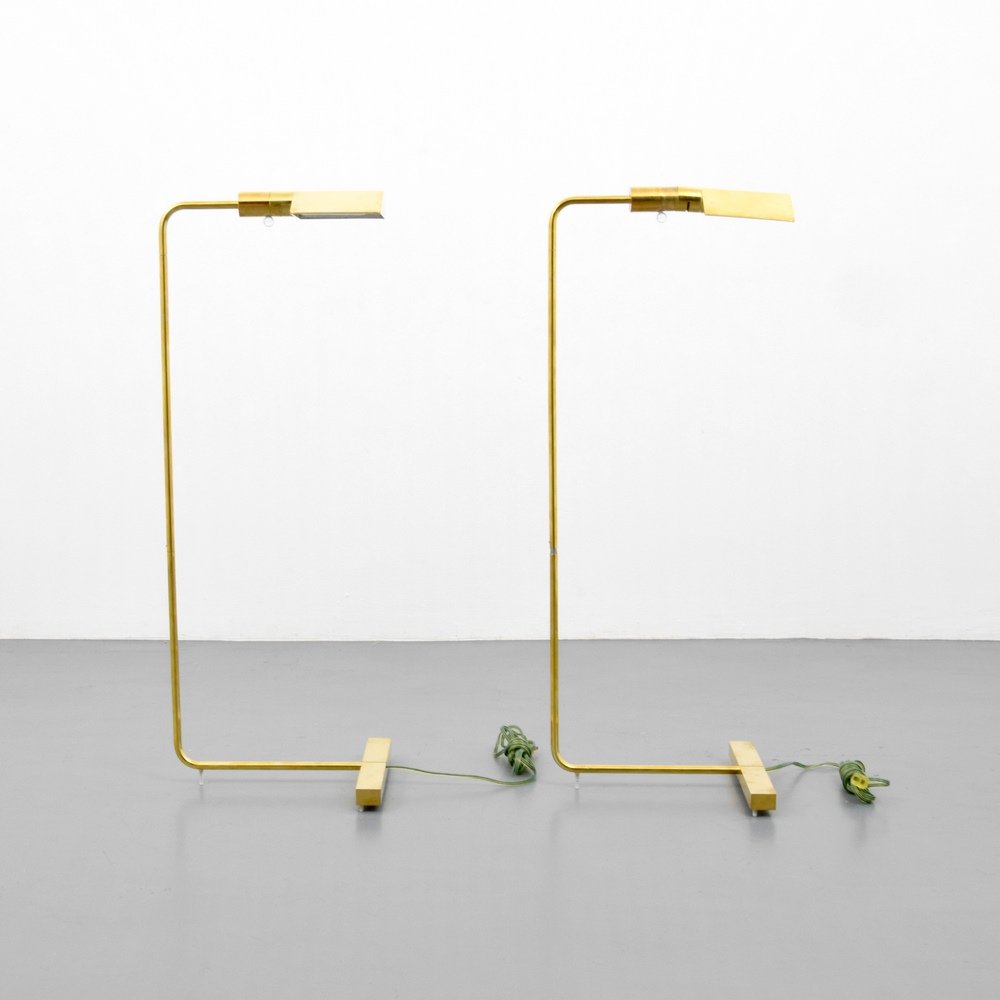 Pair of Cedric Hartman Floor Lamps: Designer & Manufacturer :Cedric Hartman Markings: signed Country of Origin & Materials: USA; brass Additional Information & Circa: Lamps adjust for height and the heads swivel. Dimensions: 36.5"h, 11"