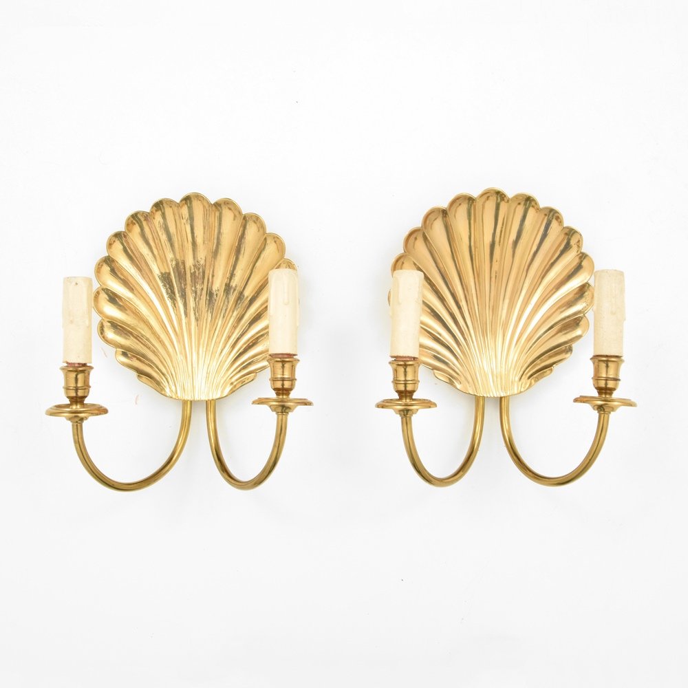Pair of Sconces Attributed to Maison Charles: Designer & Manufacturer :Maison Charles, Attributed Markings: no marking(s) apparent Country of Origin & Materials: France; brass Additional Information & Circa: Each sconce has two light sockets. Pro