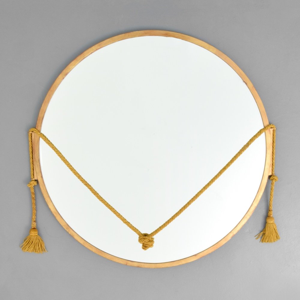 Pair of Mirrors Attributed to Maison Jansen: Designer & Manufacturer :Maison Jansen, Attributed Markings: no marking(s) apparent Country of Origin & Materials: France; brass, mirror, cording Additional Information & Circa: Dimensions: 36"dia.