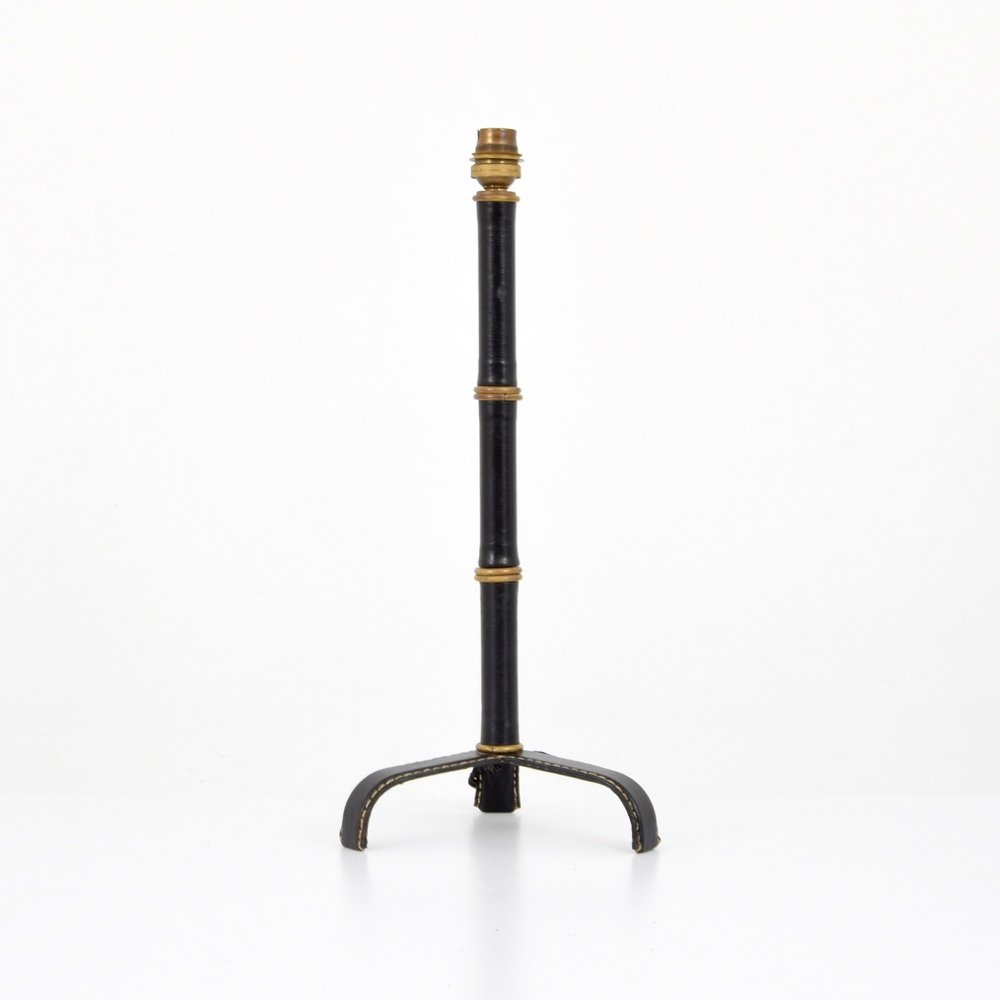 Jacques Adnet Lamp: Designer & Manufacturer :Jacques Adnet Markings: no marking(s) apparent Country of Origin & Materials: France; brass, saddle-stitched leather Additional Information & Circa: Provenance: Atomic Antique