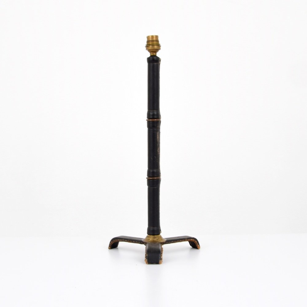 Jacques Adnet Lamp: Designer & Manufacturer :Jacques Adnet Markings: no marking(s) apparent Country of Origin & Materials: France; brass, saddle-stitched leather Additional Information & Circa: Provenance: Atomic Antique