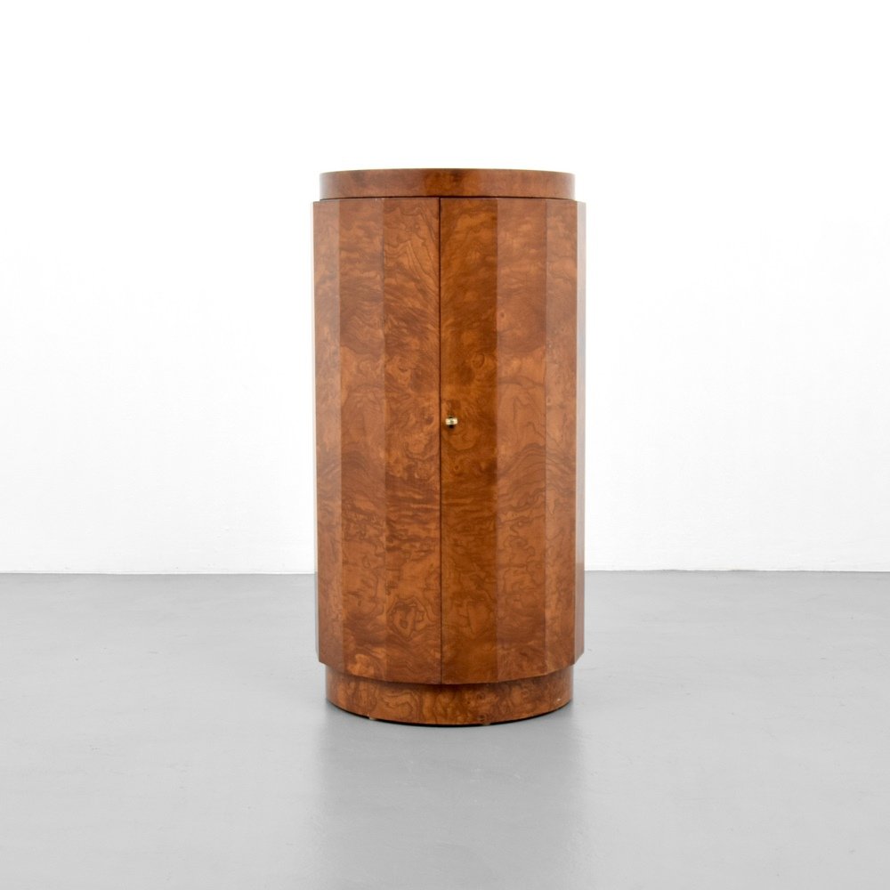 Edward Wormley Pedestal Bar: Designer & Manufacturer :Edward Wormley; Dunbar Markings: Dunbar label Country of Origin & Materials: USA; brass, burl wood Additional Information & Circa: Keyed bar has one door revealing shelves and