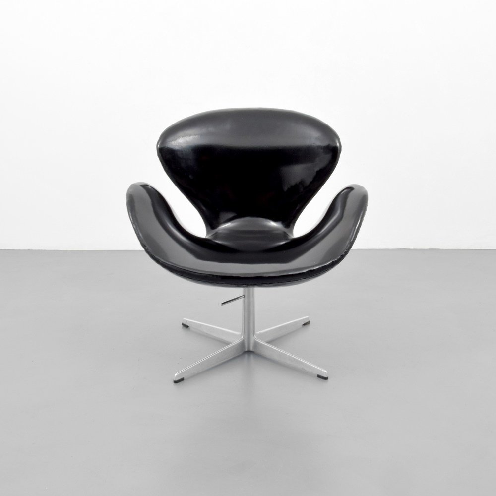 Arne Jacobsen SWAN Chair: Designer & Manufacturer :Arne Jacobsen; Fritz Hansen Markings: Fritz Hansen label Country of Origin & Materials: Denmark; metal, plastic, upholstery Additional Information & Circa: Reference: Designed