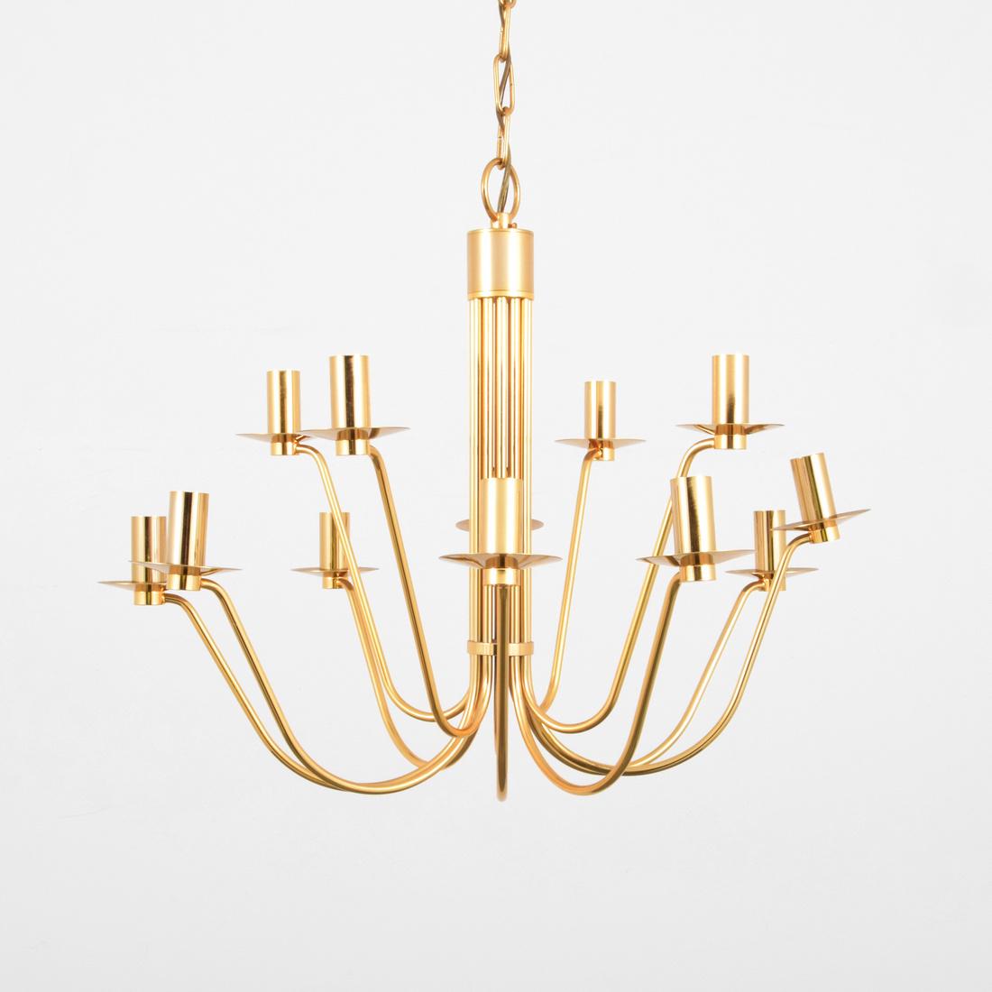 Chandelier, Manner of Tommi Parzinger: Designer & Manufacturer: Tommi Parzinger, Manner of Markings: no marking(s) apparent Country of Origin & Materials: unknown; brass Additional Information: No additional information. Dimensions(H,W,D):