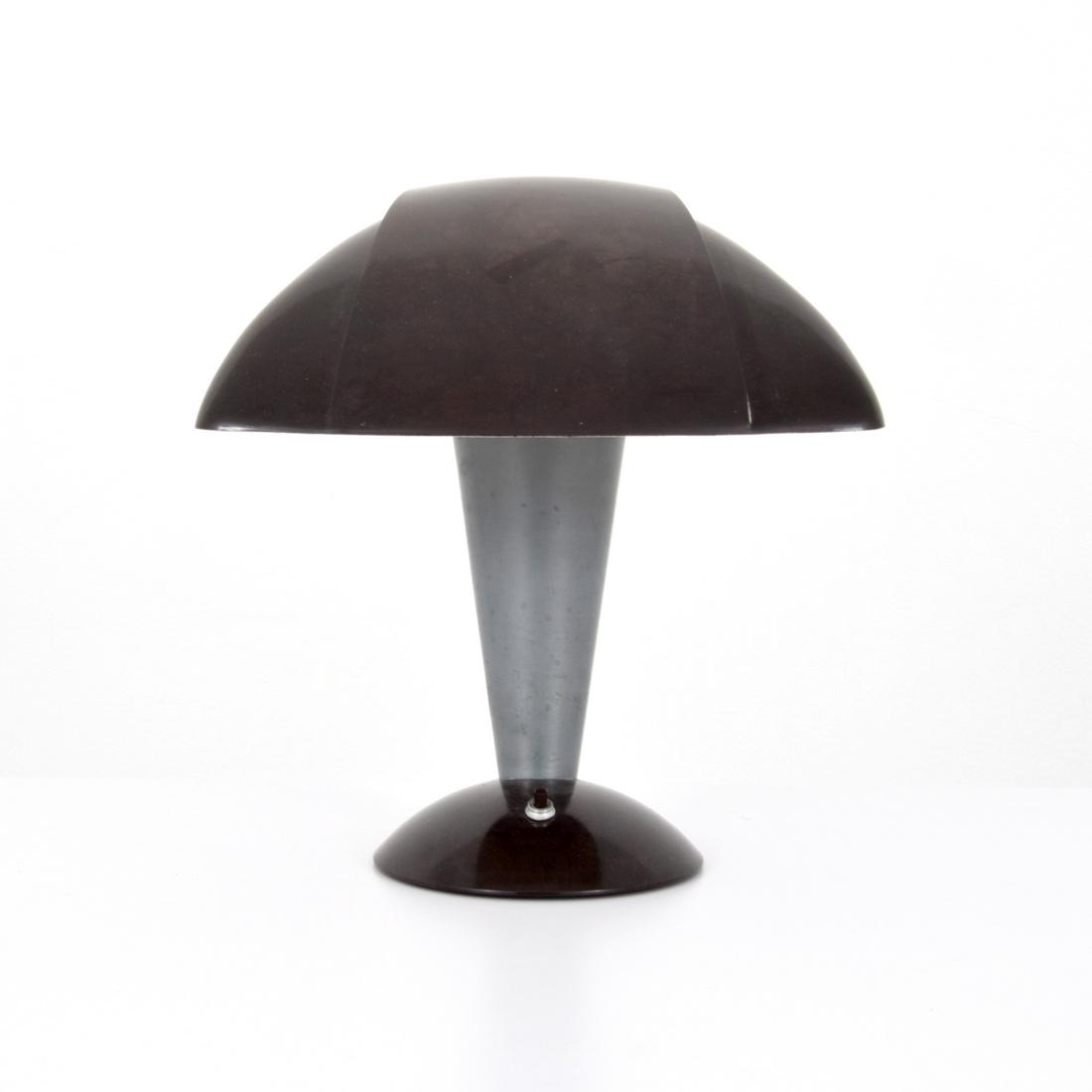 Walter Dorwin Teague POLAROID Desk Lamp: Designer & Manufacturer: Walter Dorwin Teague; Mitchell Manufacturing Co. Markings: Mitchell Manufacturing Co. label Country of Origin & Materials: USA; Bakelite, aluminum Additional Information: Lamp