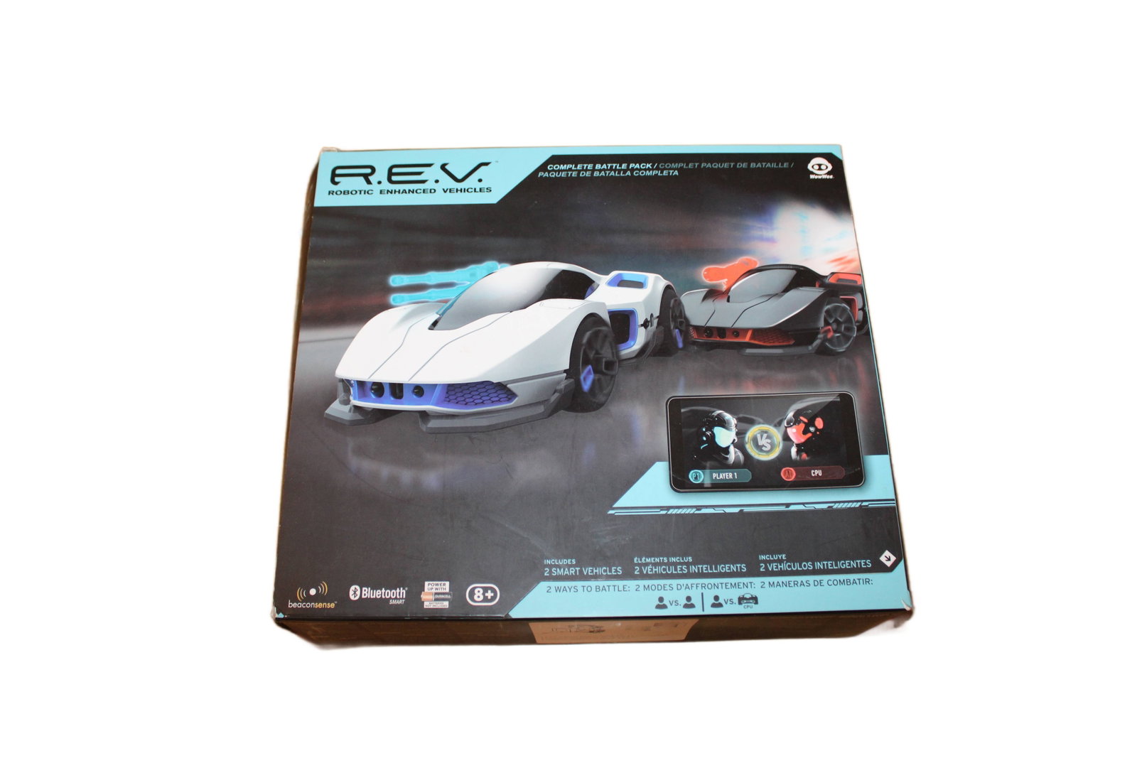 R.E.V. Robotic Enhanced Vehicles: R.E.V. Robotic Enhanced Vehicles. Includes Two Smart Bluetooth Enabled Vehicles. 10" H x 11.5" W x 3.5" D.
