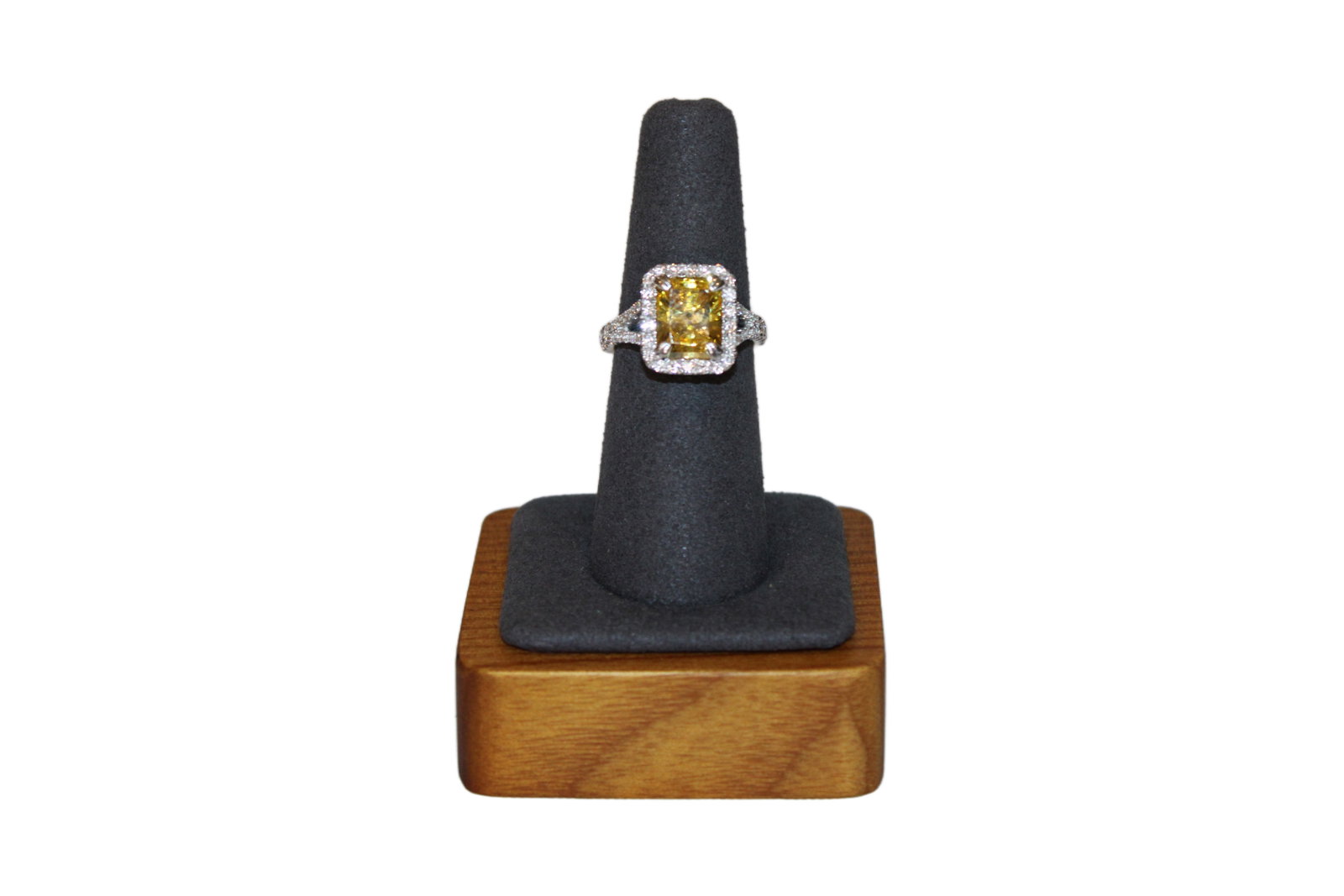 14K White Gold Diamond Ring with Canary Yellow CZ: Ladies 14K White Gold Diamond Ring with 1 Radiant Cut Canary Yellow Cubic Zirconia. 22 Round Diamonds Surrounding Center Diamond. 50 Additional Diamonds on Shank and Side of Ring Canary Yellow Cubic