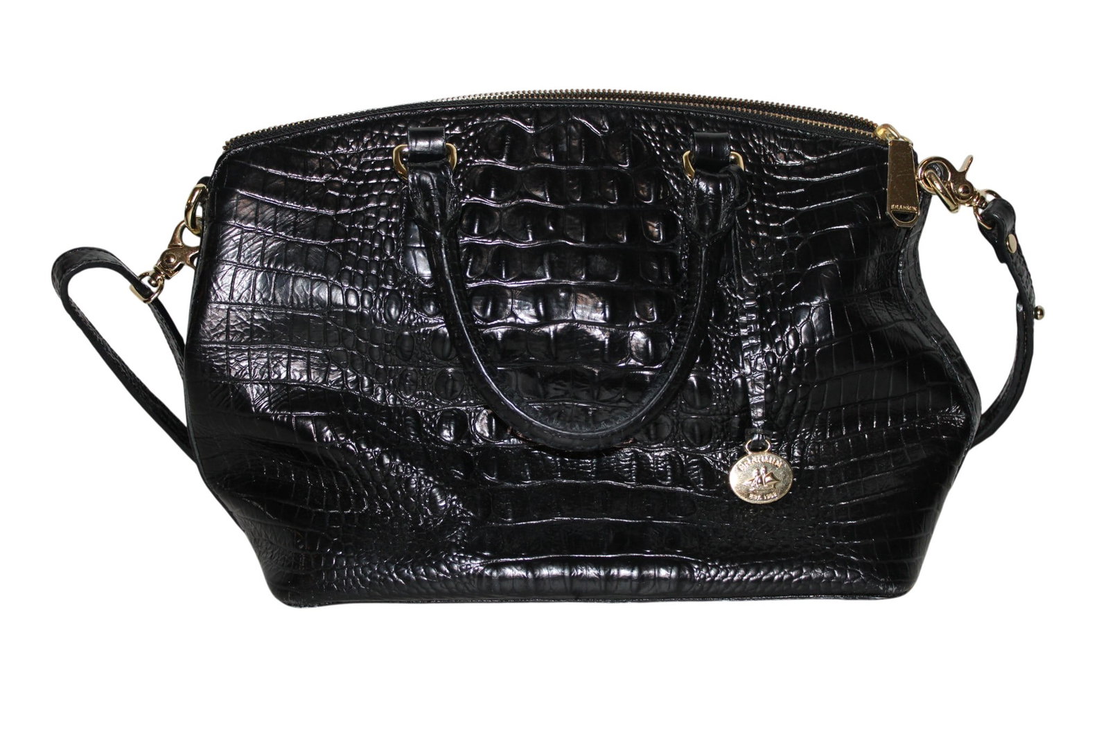 Black Leather Brahmin Purse: Black Leather Brahmin Satchel Handbag with Detachable Strap. Tan Interior Lining. One Small Exterior Pocket without Zipper. One Interior Pocket with Zipper. Two Interior Pockets without Zippers.