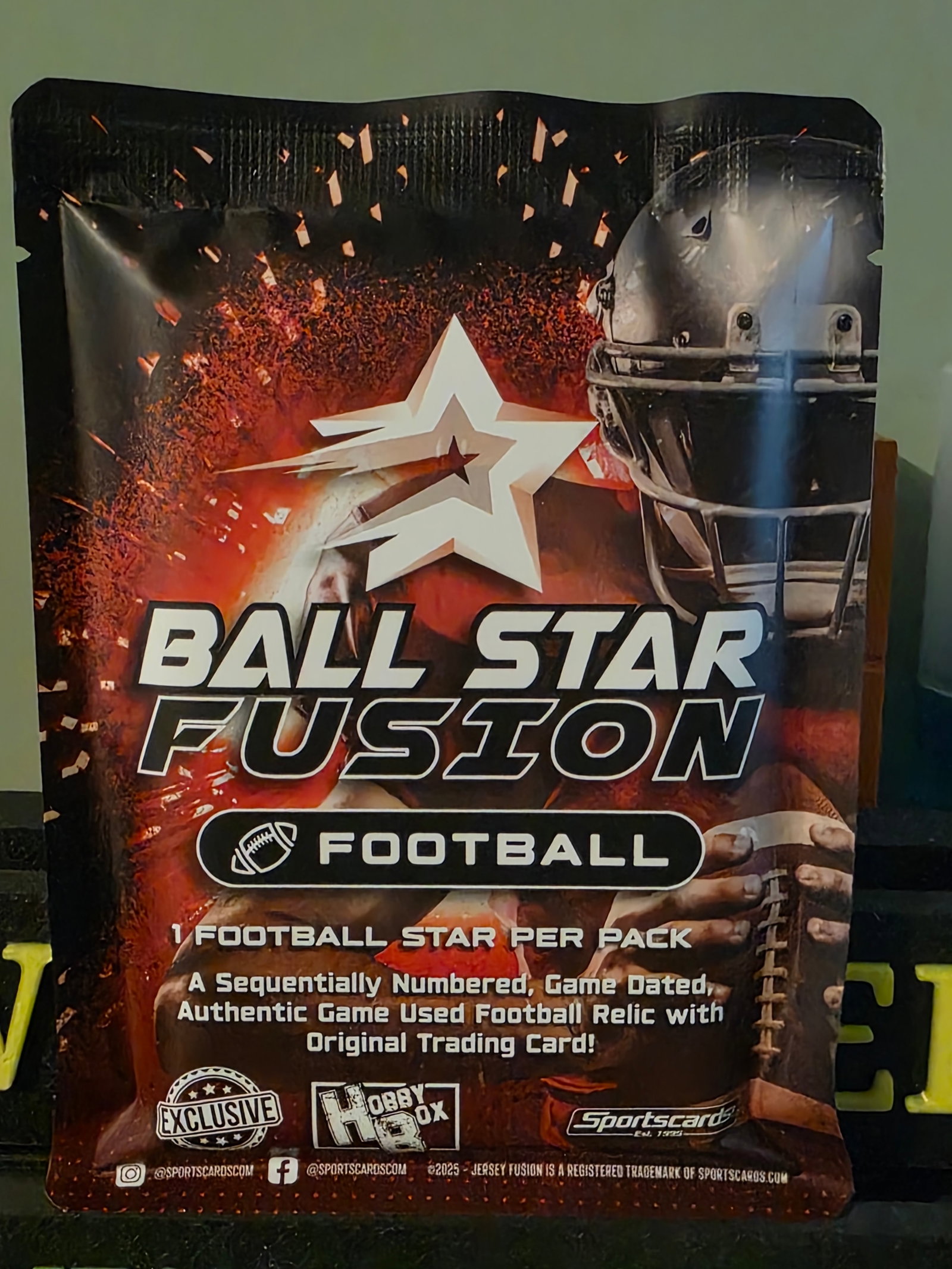 2025 Ball Star Fusion Football red Pack Factory Sealed - Game Used Football Relic: The 2025 Ball Star Fusion Football Red Exclusive Sealed Card Pack is a highly sought-after collectible item for football enthusiasts. This pack contains one exclusive card from the Ball Star Fusion