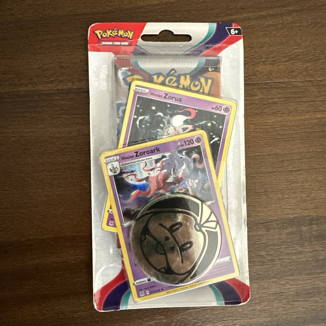Scarlet Violet Blister Pack - Zorua Zoroark Promo - Pokemon: The Scarlet & Violet (Base) Zorua and Zoroark blister is a standard-sized card set in English language, specifically designed for the Pokemon game. Manufactured by The Pokemon Company, this box set