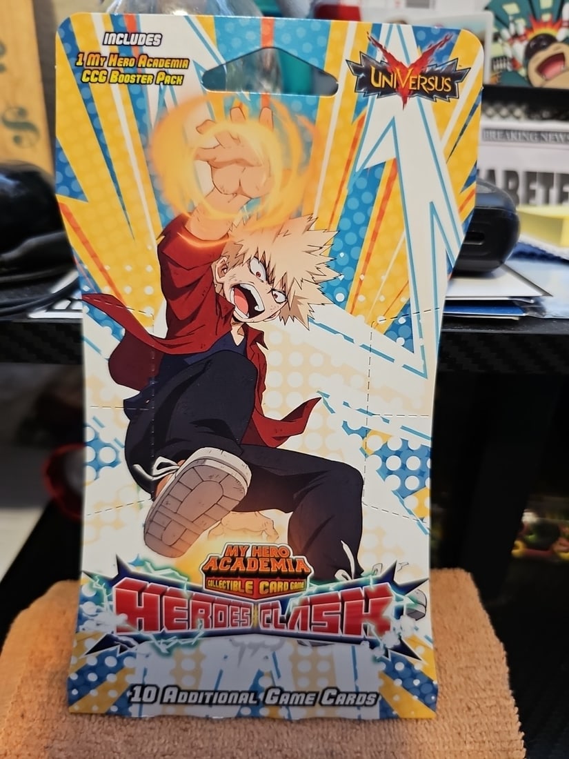 My Hero Academia Heroes Clash Card Pack with 10 cards Universus 2022: Dive into the action-packed world of My Hero Academia with the Heroes Clash Card Pack, featuring 10 collectible cards from Jasco Games. Each pack contains a mix of powerful heroes like All Might, Kats