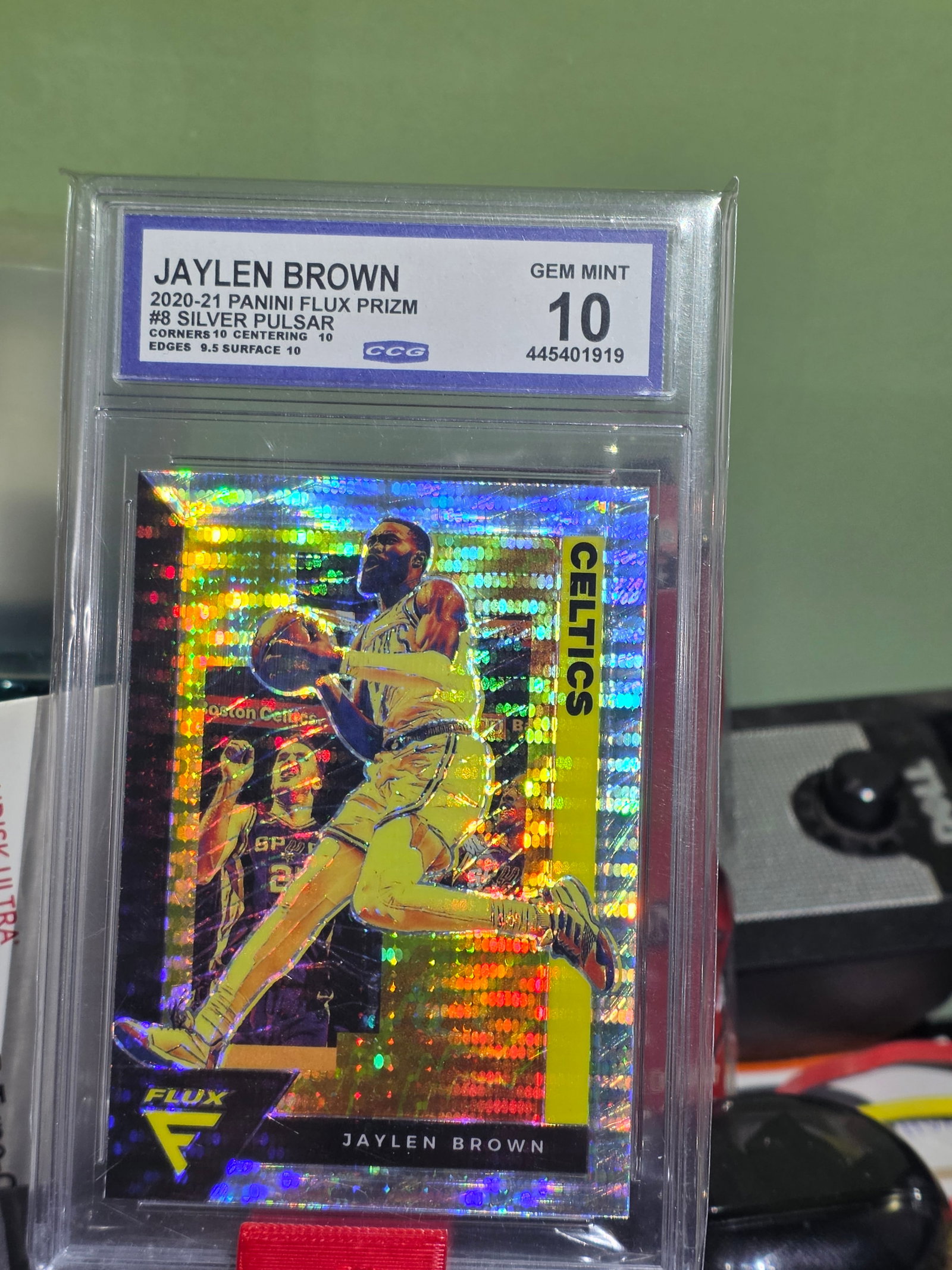 2020-21 Panini Flux #8 Jaylen Brown Silver Pulsar GRADED GEM MINT CCG 10 Celtics: This 2020-21 Panini Flux #8 Jaylen Brown Silver Pulsar trading card is a must-have for any basketball fan. Graded GEM MINT CCG 10, this card features Jaylen Brown, a talented player for the Boston Cel