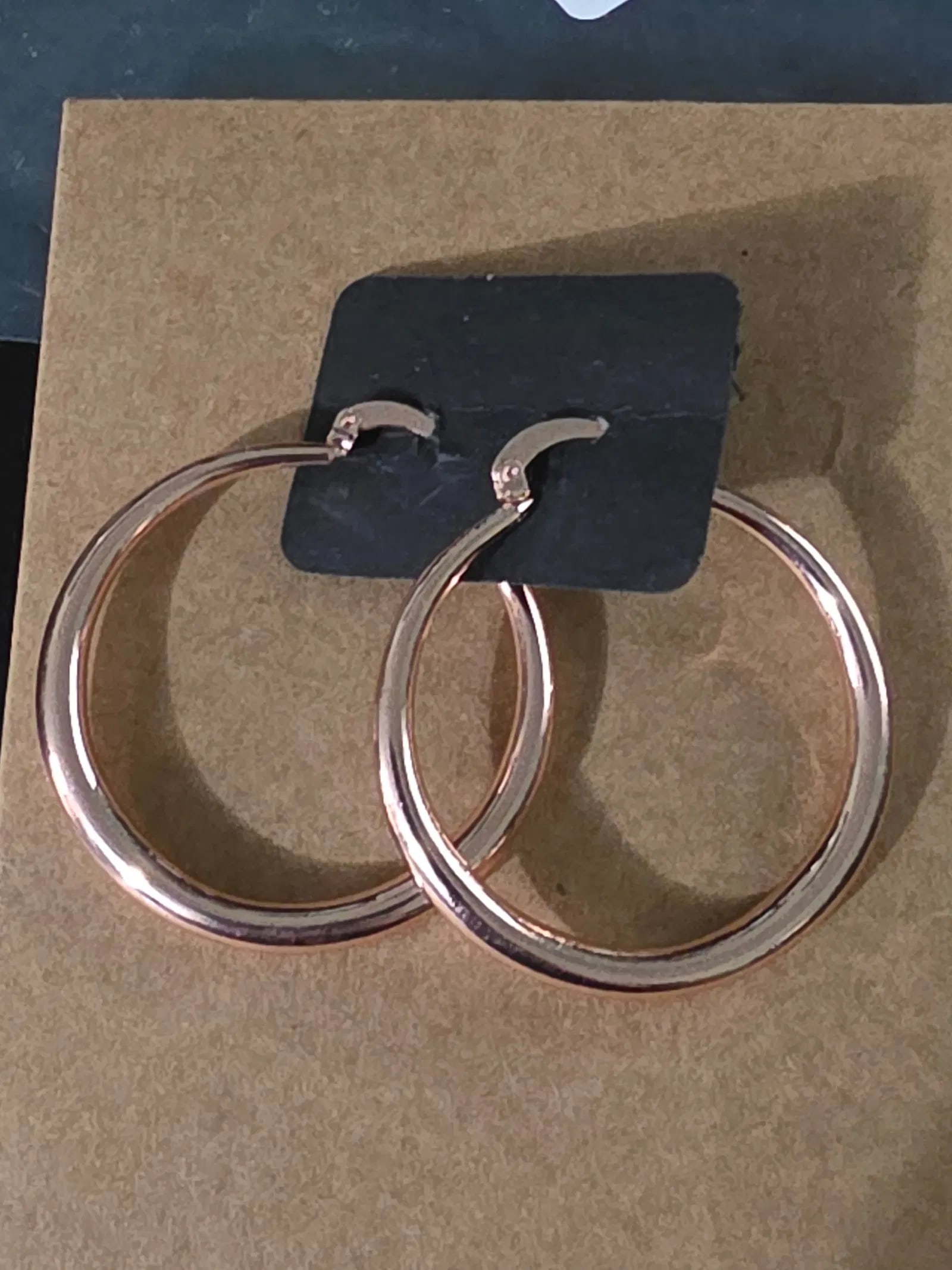 Copper colored looped ear rings (1 of 2)