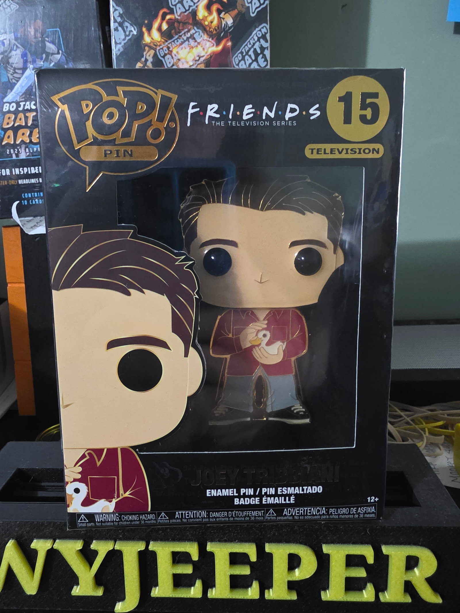 Funko Pop! Pin FRIENDS Joey Tribbiani #15 Enamel Pin: The Funko Pop! Pin FRIENDS Joey Tribbiani #15 Enamel Pin is a collectible item inspired by the popular TV show Friends. This multicolor pin features Joey Tribbiani, a beloved character from the show,