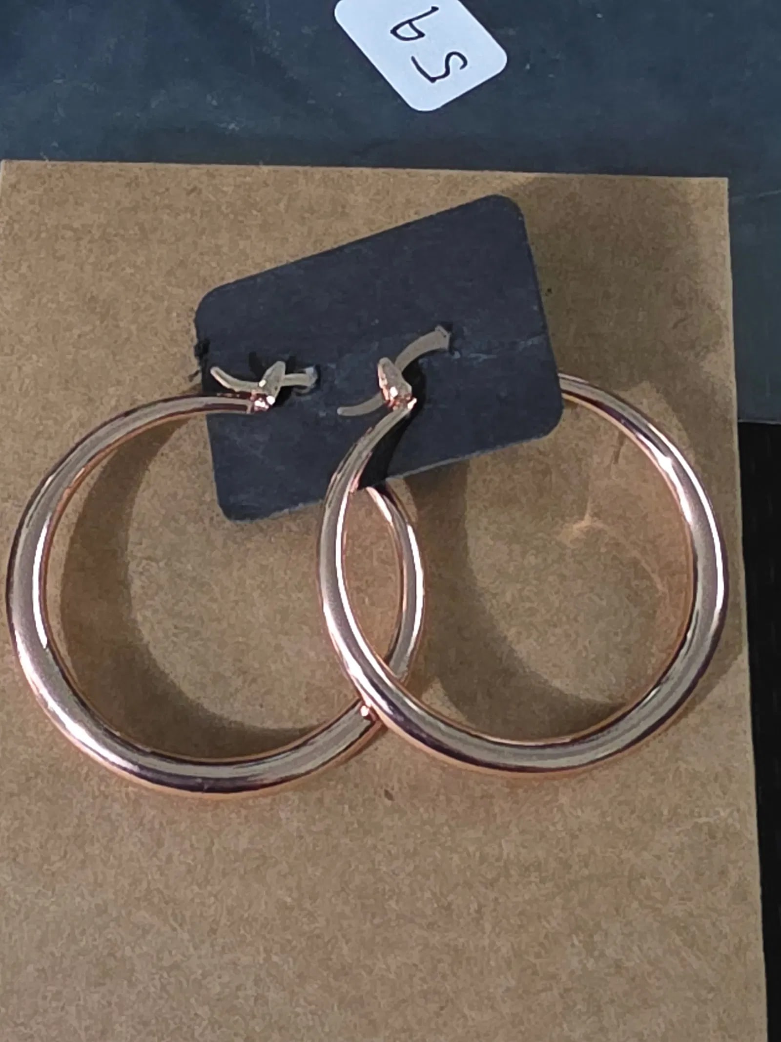 Copper colored looped ear rings: new set of copper colored looped ear rings.