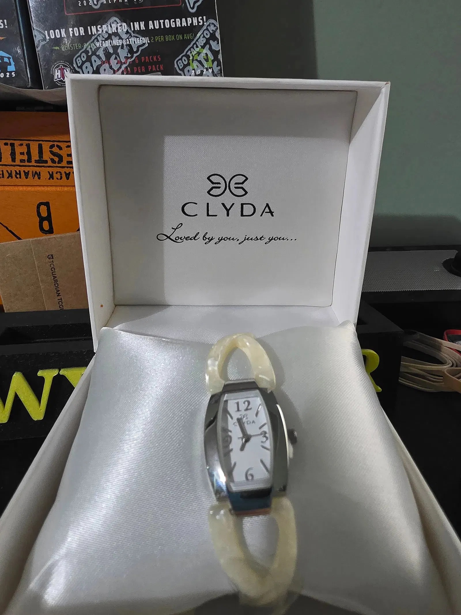 NEW Clyda Silver Tone and Ivory Acetate Watch Rectangle: The NEW Clyda Silver Tone and Ivory Acetate Watch Rectangle is a stylish and elegant wristwatch designed for women. With a rectangular case and ivory bezel and band colors, this quartz movement watch