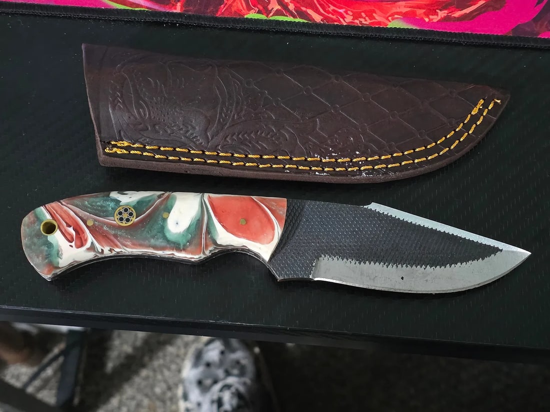 MHS Cutlery 8" Hunting Knife Drop Point Leather Sheath Hand Made: The MHS Cutlery Damascus Fixed Blade is a custom and handmade hunting knife with a drop point blade made of Damascus steel. It features a gray blade with a black wood handle, making it suitable for