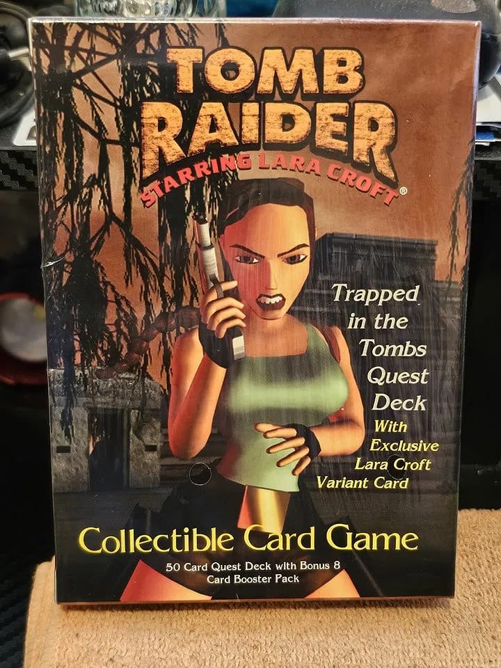 Tomb Raider Starring Lara Croft trapped in the Tombs Quest Deck: Embark on an adventure with the "Tomb Raider Starring Lara Croft CCG 58-Cards Quest Decks," a collectible card game from Precedence. This starter deck, factory sealed and vintage from 1999, is a