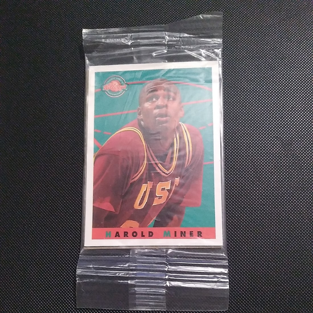 Harold Miner Kelloggs PROMO College Greats Poster Card: The product is a Harold Miner Kellogg's promotional college greats poster card, featuring a basketball player. This sports trading card is sealed and in near mint or better condition. Manufactured by