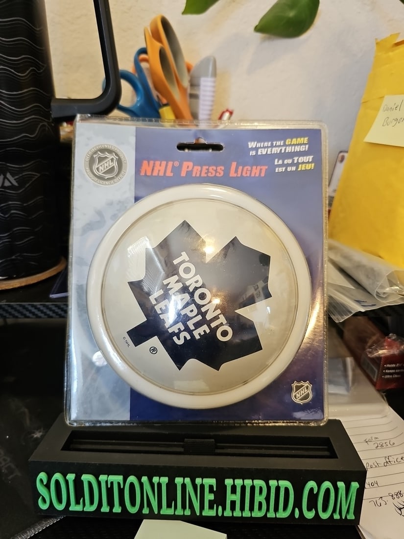 Officially licensed NHL Press Light Toronto Maple leafs: The Officially licensed NHL Press Light featuring the Toronto Maple Leafs logo is a unique and stylish addition to any hockey fan's collection. Made by Iax Sports, this product is designed for fans