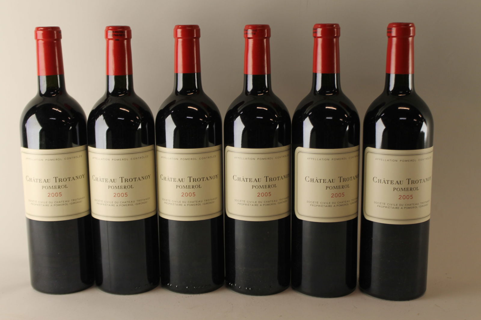 Château Trotanoy 2005: Château Trotanoy 2005 Pomerol Excellent level and appearance R 6 bottles Per lot €1200 - 1600SizebottlesConditionExcellent level and appearanceExhibited(OWC)