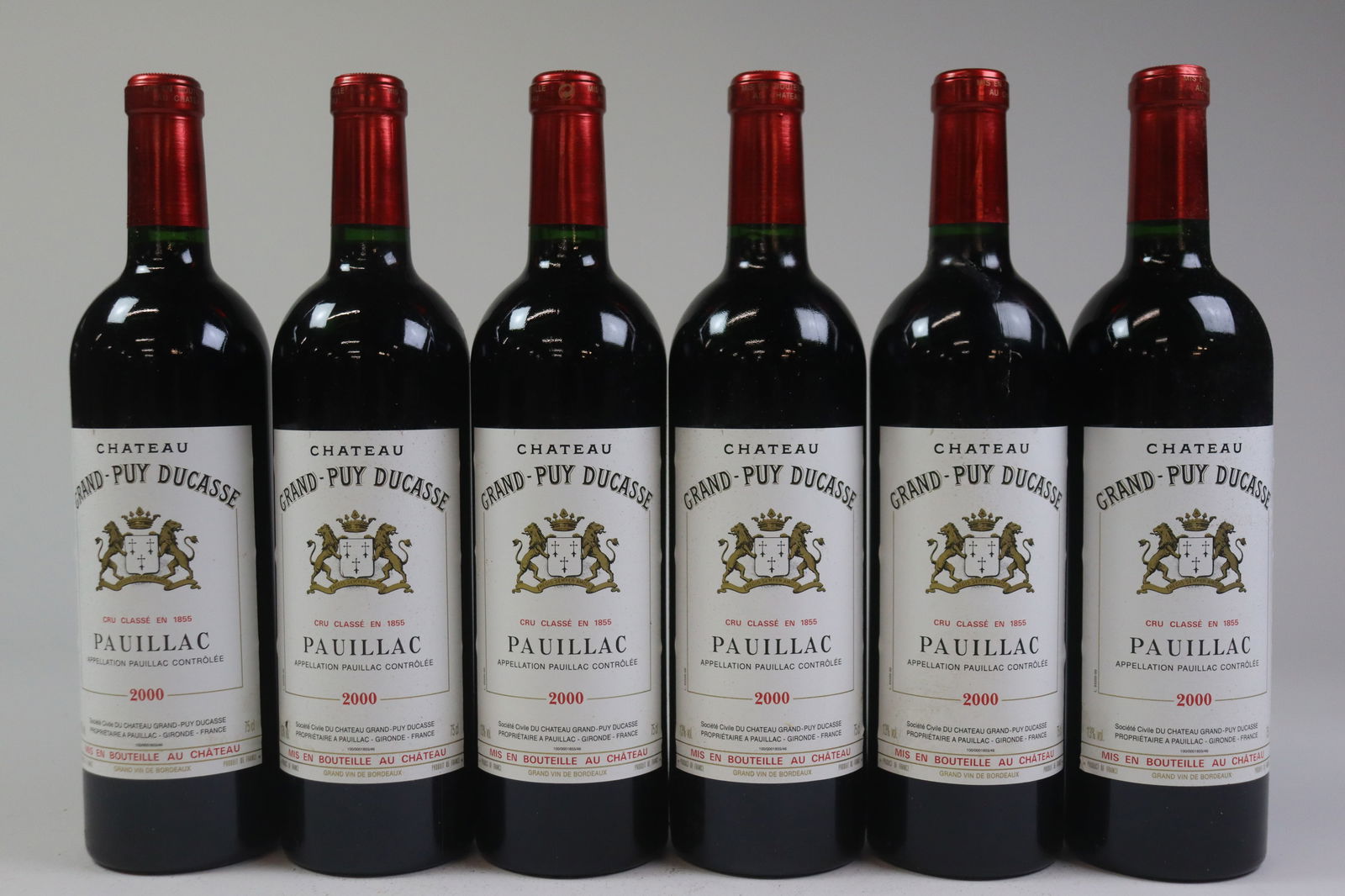 Château Grand-Puy Ducasse 2000: Château Grand-Puy Ducasse 2000 Pauillac, 5ème Grand Cru Classé Excellent level, LSTL, 2LNL R 12 bottles Per lot €440 - 550 Size bottles Condition Excell