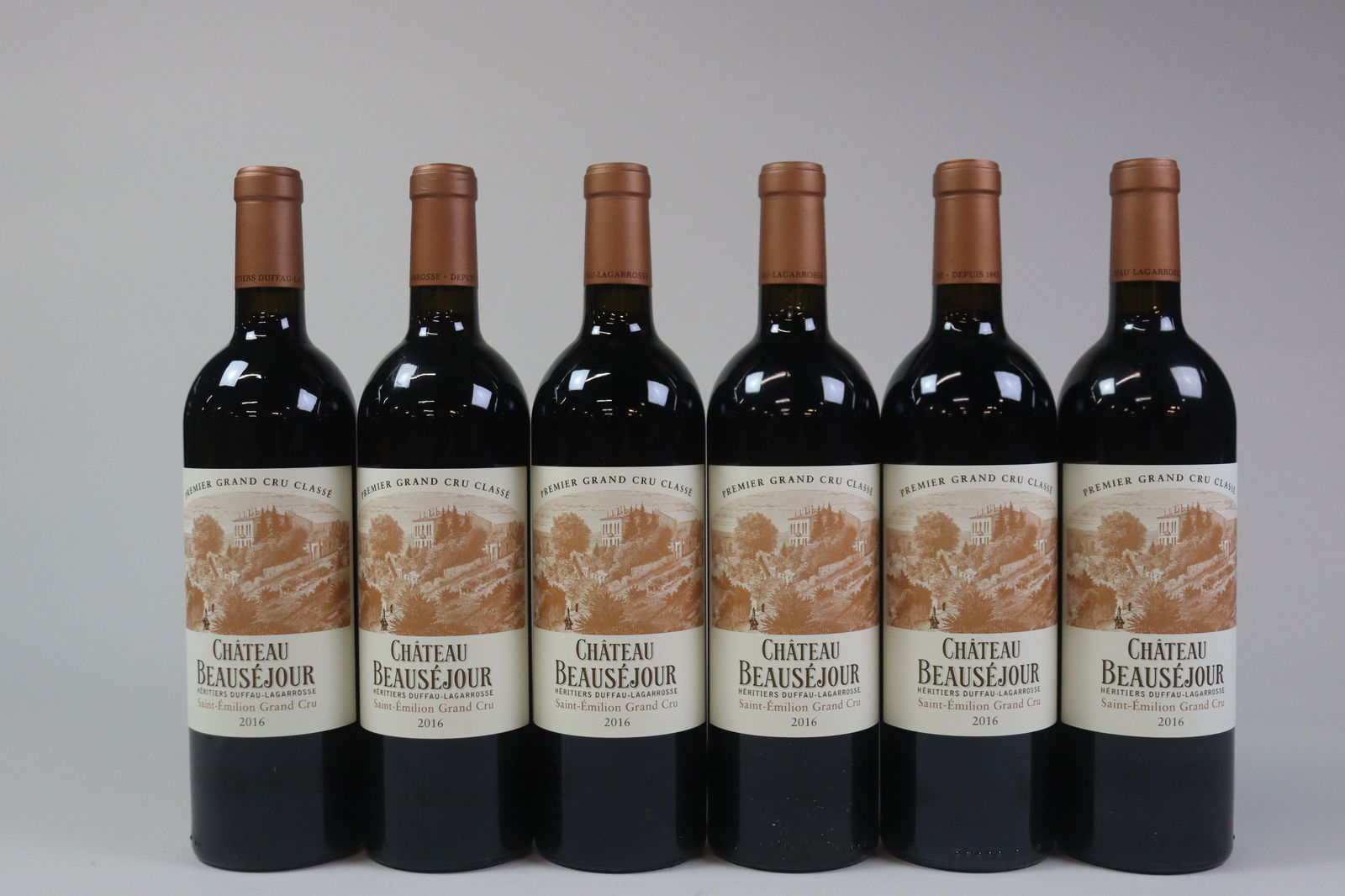 Château Beauséjour Duffau-Lagarrosse 2016: Château Beauséjour Duffau-Lagarrosse 2016 Saint-Émilion, 1er Grand Cru Classé B Excellent level and appearance R 6 bottles Per lot €500 - 700 Size bottles