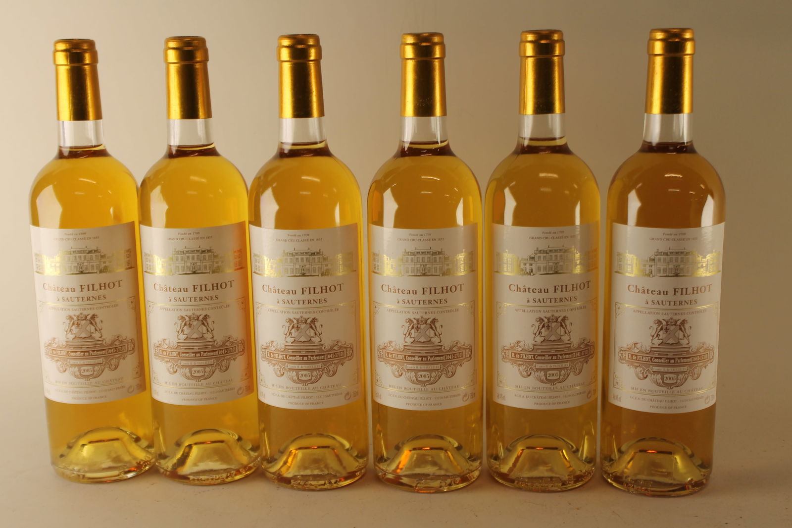 Château Filhot 2005: Château Filhot 2005 Sauternes, 2ème Grand Cru Classé U. IN, excellent appearance W 12 bottles Per lot €320 - 420 Size bottles Condition U. IN, excellent