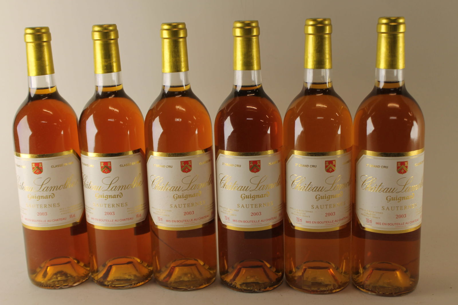 Château Lamothe Guignard 2003: Château Lamothe Guignard 2003 Sauternes, 2ème Grand Cru Classé U. BN, excellent appearance W 12 bottles Per lot €320 - 420 Size bottles Condition U. BN,