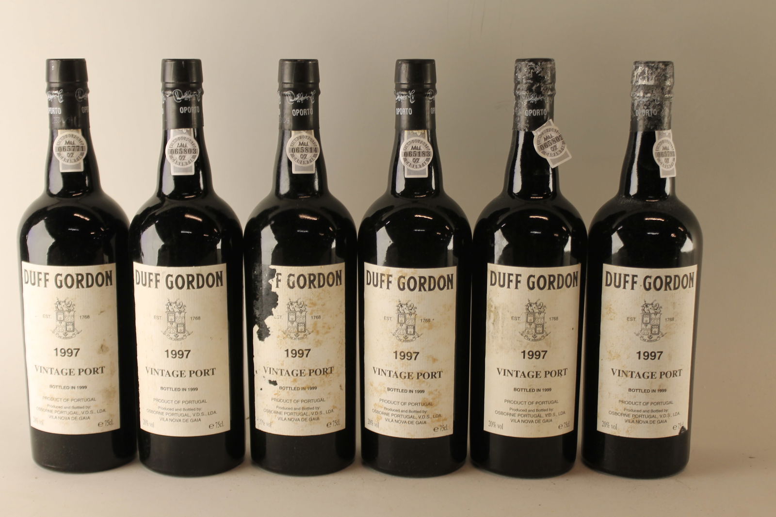 Duff Gordon Vintage Port 1997: Duff Gordon Vintage Port 1997 Bottled in 1999 U. 3.5cm BC, LSTL, SCL, LCC F 12 bottles Per lot €260 - 360SizebottlesConditionU. 3.5cm BC, LSTL, SCL, LCCExhibited(OWC)