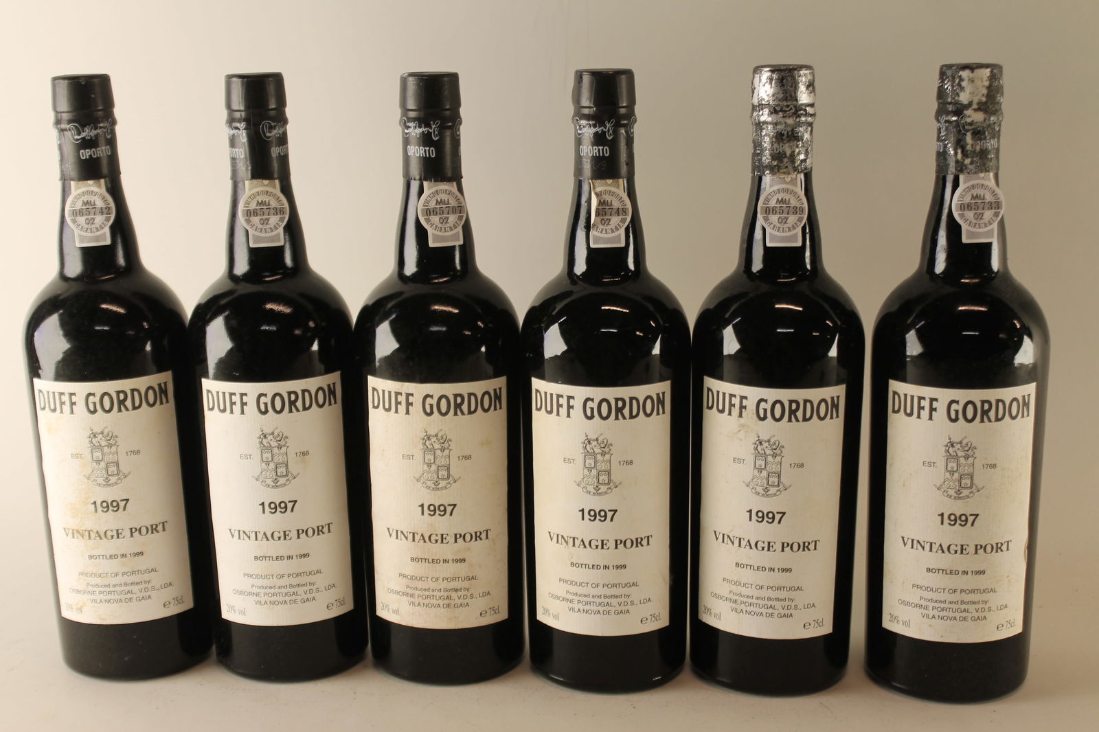 Duff Gordon Vintage Port 1997: Duff Gordon Vintage Port 1997 Bottled in 1999 U. 3.5cm BC, LSTL, LCC F 12 bottles Per lot €260 - 360SizebottlesConditionU. 3.5cm BC, LSTL, LCCExhibited(OWC)