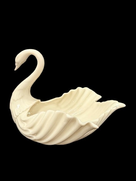 Pair of Lenox Ivory Porcelain Swans 7-Inch and 3-Inch: A pair of Lenox ivory porcelain swans in two sizes at 7 inches and 3 inches tall, from America's leading fine china brand. Lenox porcelain animal figurines are classic decorative pieces with broad