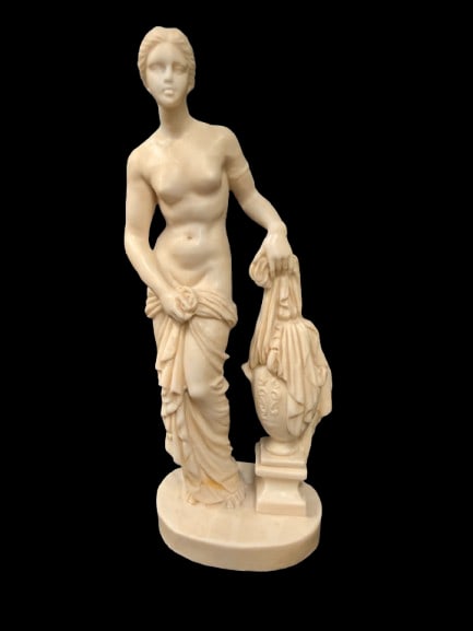 A Santini Aphrodite of Knidos Statue 10-Inch Tall: An A. Santini reproduction of the Aphrodite of Knidos standing 10 inches tall. Santini sculptures are known for faithful classical reproductions that bring museum-quality art into the home.