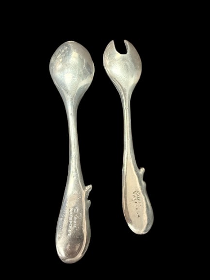 1995 Mariposa Brilliante Serving Set Spoon and Fork: A 1995 Mariposa Brilliante serving set consisting of a spoon and fork each 13 inches long, crafted in the distinctive Mariposa style known for quality and unique aesthetic.
