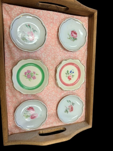 Vintage Japanese porcelain petite saucers with scalloped edges and floral designs. Set of 6: This is a delicate set of six (6) vintage petite porcelain saucers, meticulously crafted in Japan. These pieces feature a classic scalloped rim, which provides a graceful, undulating silhouette that c
