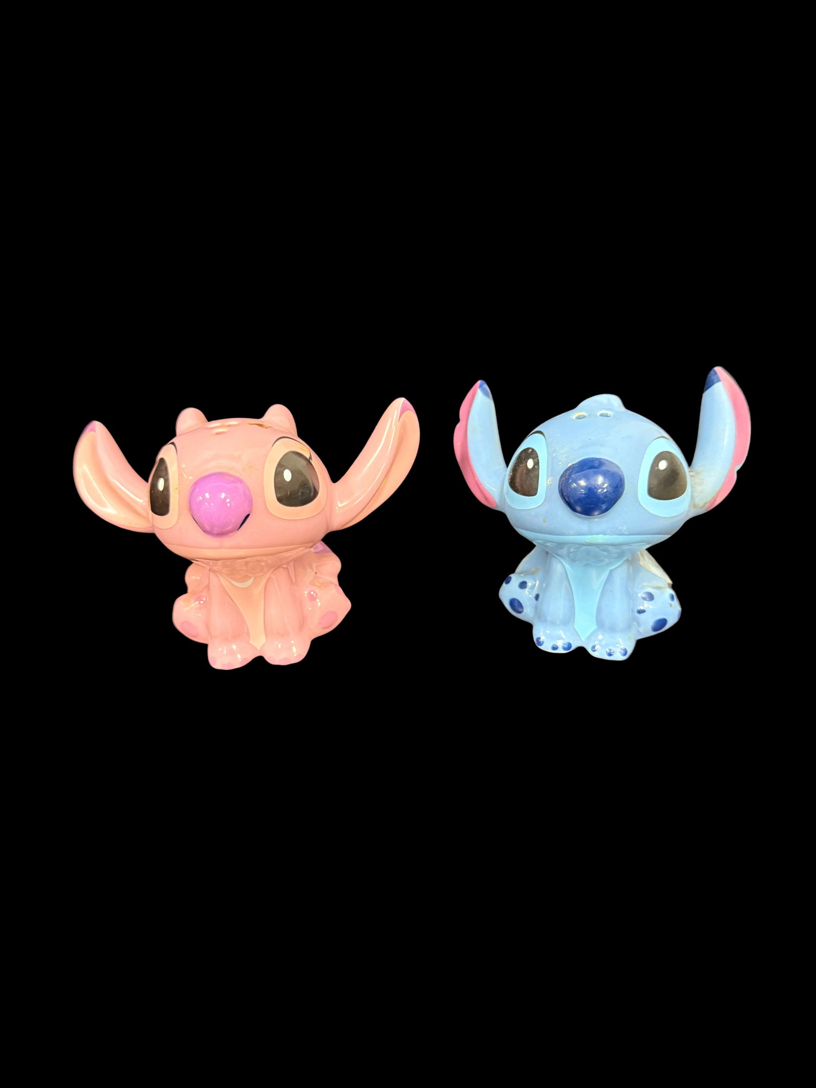 Disney Lilo & Stitch Angel and Stitch ceramic salt and pepper shakers: A delightful contemporary collectible from the Disney Ceramics line, this salt and pepper shaker set features the iconic Experiment 626, Stitch, and his female counterpart, Angel (Experiment 624). The