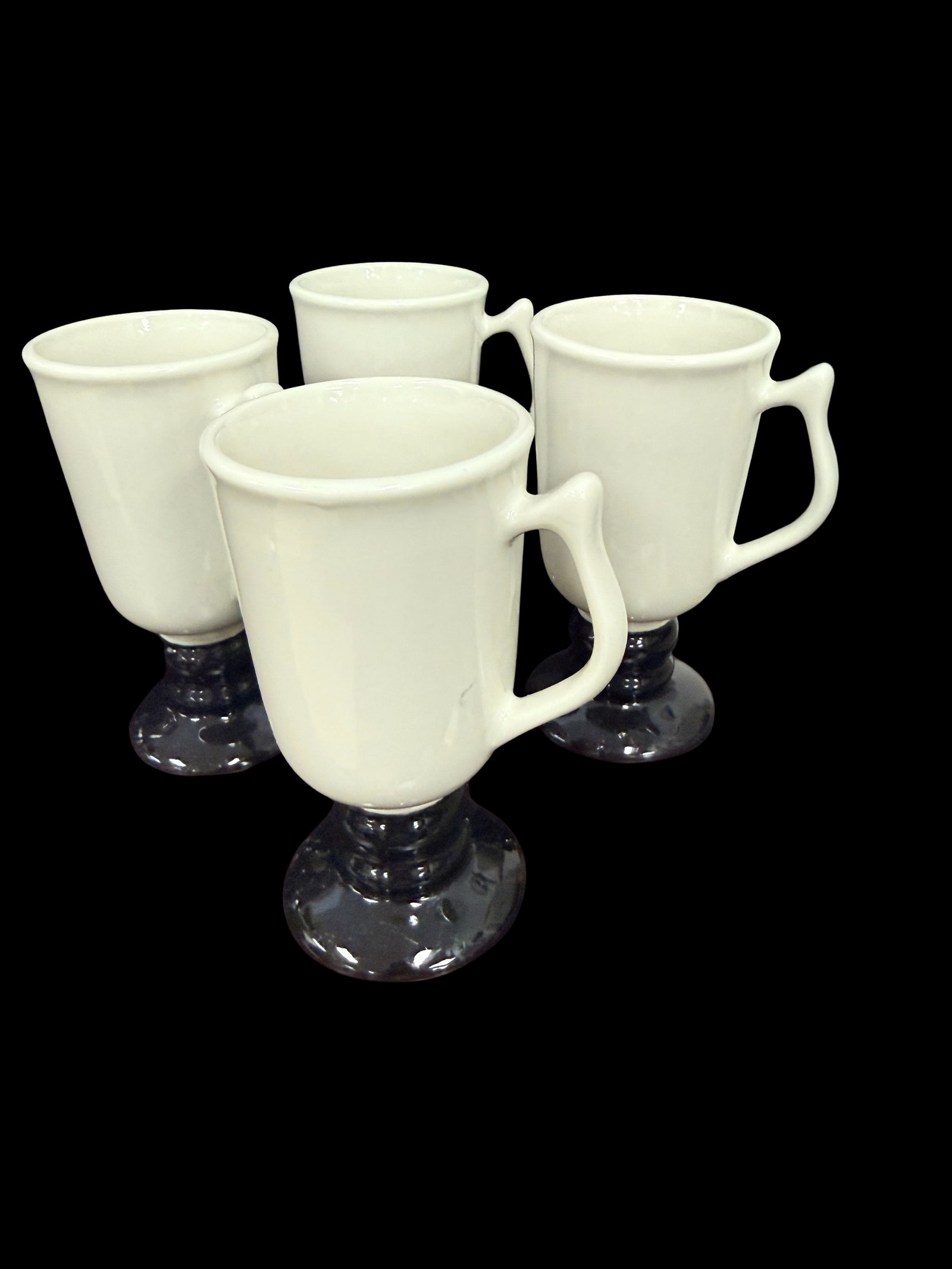 Set of 4 Coffee Cups White and Black 4-Inch Tall: A set of four white and black coffee cups each measuring 3x2 inches and weighing 2 pounds total. A clean modern set suitable for everyday use or gifting.