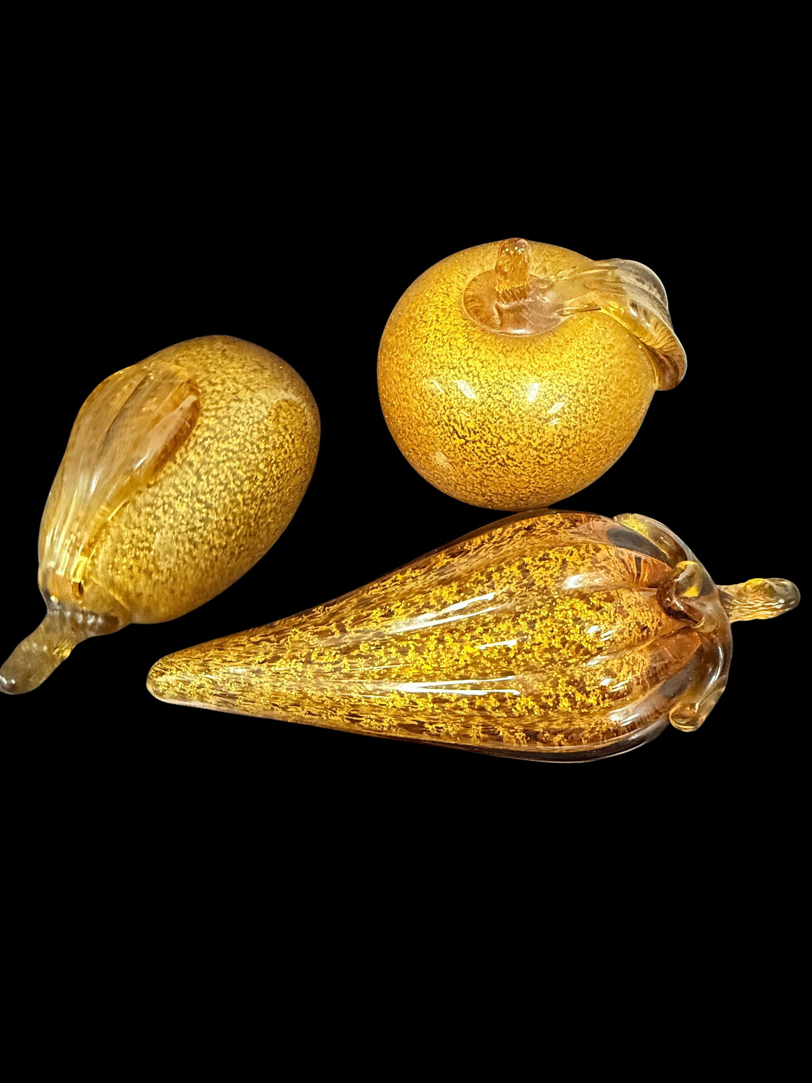 Vintage Mid-Century Murano glass fruit figurines - Set of 3 - Made In Italy: A stunning trio of authentic Murano art glass fruit figurines, handcrafted by master glassblowers on the island of Murano, Italy. This set typically features quintessential mid-century forms, such as 