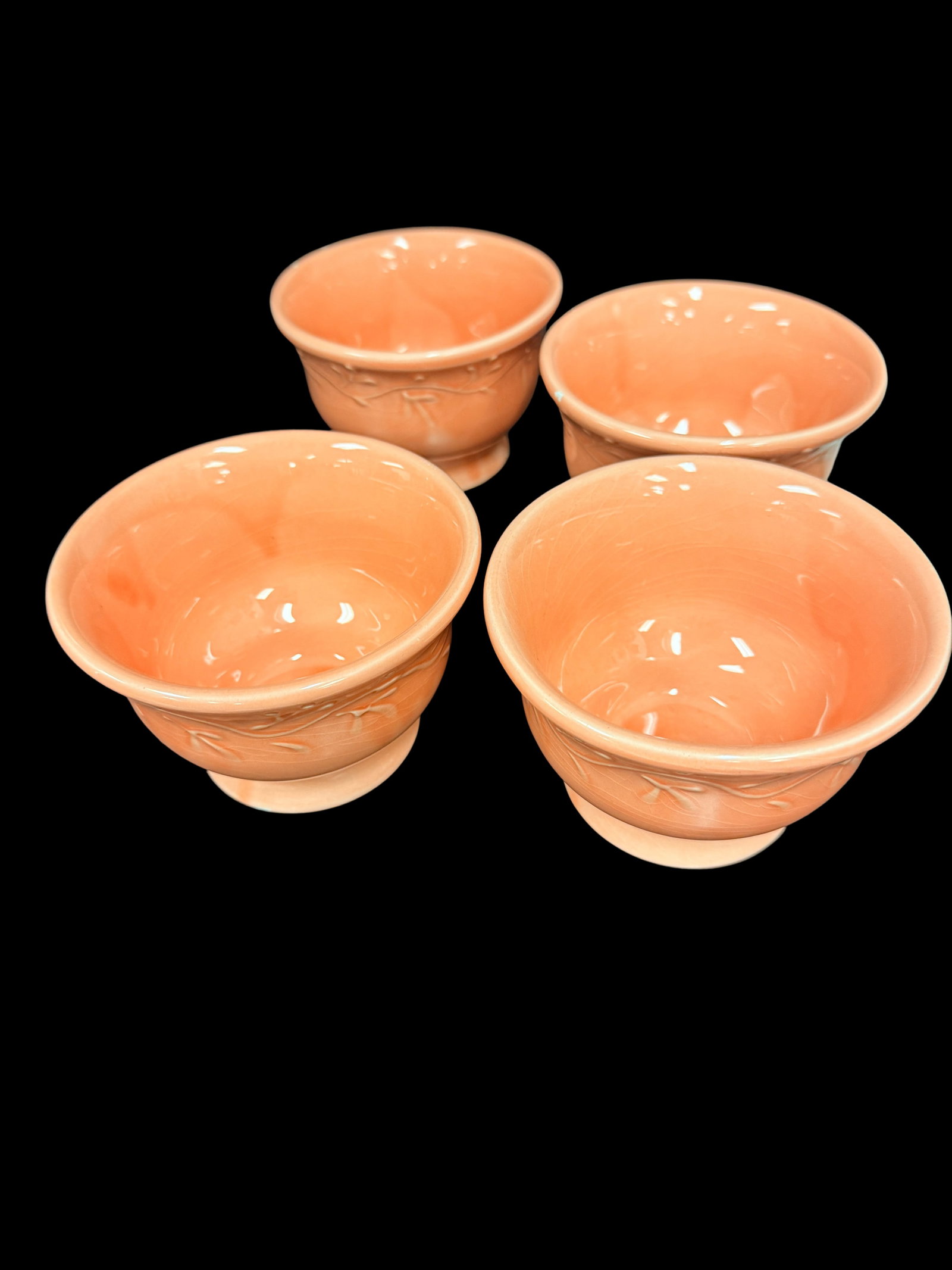 Vintage pink pottery bowls produced by Nelson McCoy - Set of 4: This is a beautiful set of four (4) vintage pottery bowls produced by the Nelson McCoy Pottery Company of Roseville, Ohio. These pieces represent McCoy’s mastery of solid-color pastel glazes, featur
