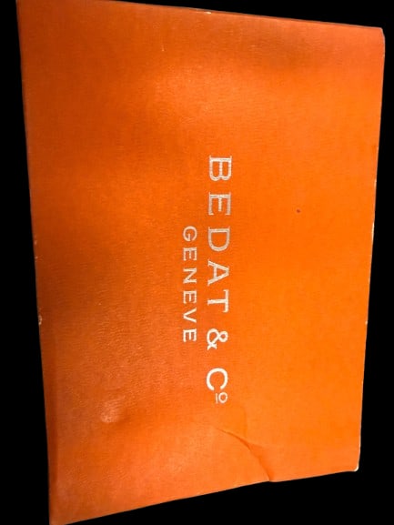 Bedat and Co Geneve Orange Watch Gift Box: A luxury Bedat and Co. Geneve branded orange gift box, from the prestigious Swiss watchmaker. A collectible luxury brand presentation box sought by watch enthusiasts.