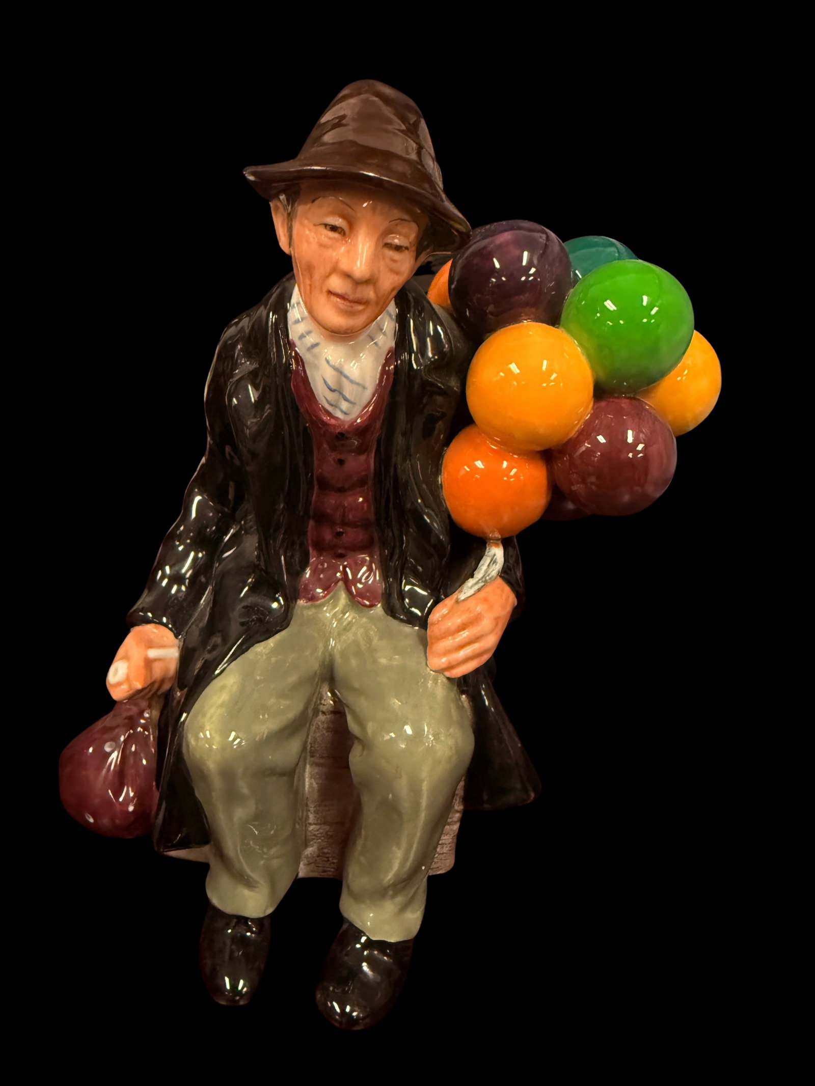The Old Balloon Seller Man and Woman Figurine Pair: A classic pair of The Old Balloon Seller figurines with colorful balloon bouquets. A beloved and widely collected figurine series with strong secondary market demand.